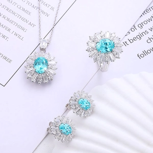 Detailed close-up of S925 silver jewelry set featuring light blue Paraiba gemstones