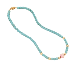 Turquoise beaded necklace with a pink eye-pattern bead and gold lobster clasp closure