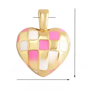 Detail view of heart-shaped checkerboard pendant in pink and white enamel with gold plating