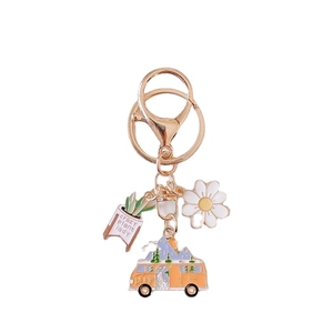 Garden style keychain with green plant pot, white daisy and moon camper charms