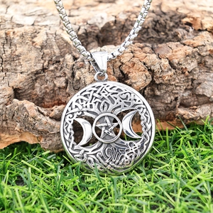 Detailed engraving of vintage tree of life and pentagram moon on stainless steel pendant