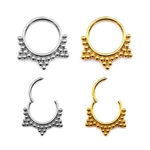 Detail of 316 stainless steel flower nose rings with beads and hinged opening closure