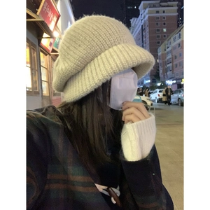 Cozy beige oversized knit beanie for women featuring a stylish wide-cuff winter design