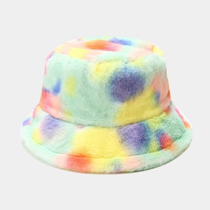 Detail of colorful tie-dye faux rabbit fur bucket hat with soft plush texture and wide brim