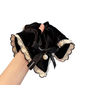 Velvet hair scrunchie with lace trim, black ribbon bow and elegant pearl pendant