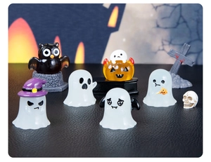 Miniature resin Halloween figurine set with glowing ghosts and pumpkins in a night scene