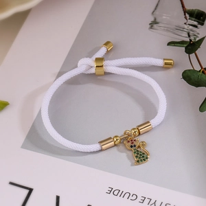 Braided rope bracelet with gold-plated cat pendant and colorful cubic zirconia