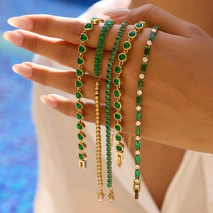Detail of five 18K gold-plated stainless steel bracelets with green zircon stones
