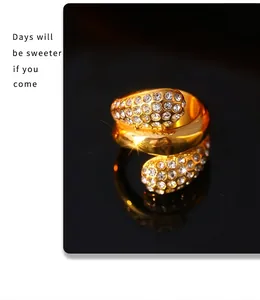 Close-up of gold plated layered ring with zircon inlay and sparkling crystal details