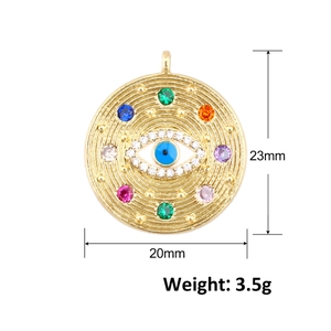Macro shot of 23mm gold-plated Evil Eye pendant with colorful zircon stones