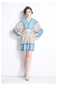 Detail of boho floral print dress with V-neckline and balloon sleeves with waist belt