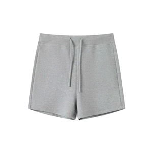 Detail of gray knitted yoga shorts showing drawstring waist and breathable fabric texture
