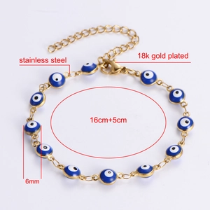 Detail view of 18k gold plated stainless steel Evil Eye bracelet with 6mm blue beads