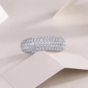 Detailed view of sterling silver band ring with micro-paved sparkling white moissanite