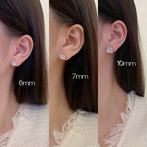 Size comparison of 6mm, 7mm, and 10mm square cubic zirconia studs on ear model