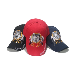 Three embroidered baseball caps featuring Native Pride wolf design in red, black and navy