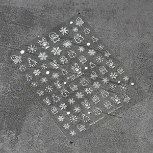 3D embossed Christmas nail stickers featuring white elk, snowman and snowflake designs