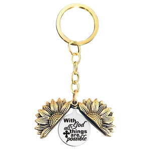 Detailed macro view of an antique gold sunflower keychain with engraved inspirational quote