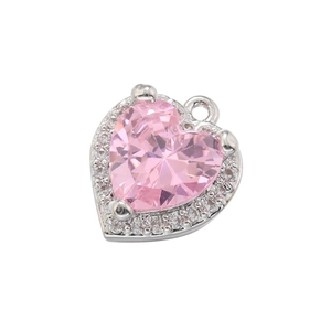 Macro shot of 18K gold-plated heart pendant with pink zircon and micro-pave setting