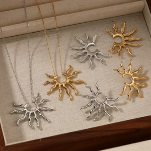 316 stainless steel sun pendant necklace set in gold and silver finish, displayed in a box