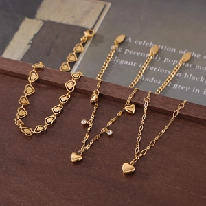 Elegant gold titanium heart-patterned anklet set with minimalist engraved charms for women
