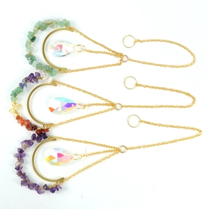 Three crystal suncatchers with gold moon frames, colorful natural stones and teardrop prisms