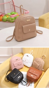 Close-up of heart floral embossed PU leather mini backpacks in five assorted colors
