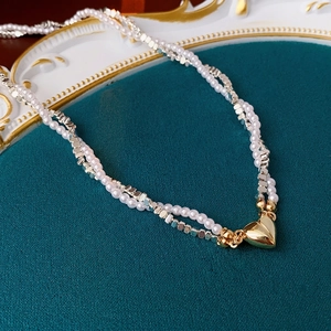 Double-layered faux pearl and silver square bead necklace with a gold heart magnetic clasp
