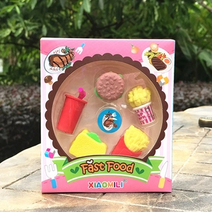 Macro detail of fast food erasers set featuring hamburger and fries in pink packaging