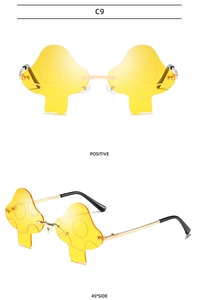 Mushroom shaped sunglasses in yellow tint with gold metal frame from two angles