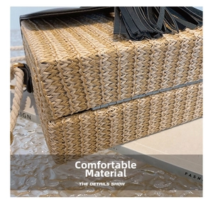 Close-up of woven straw bag detail featuring black leather fringe and cotton rope strap