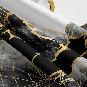 Macro shot of mountain tapestry fabric with black marble pattern and gold geometric lines