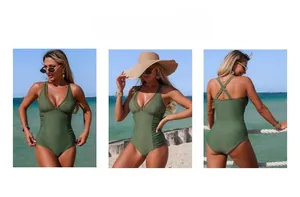 Detail view of army green one-piece swimsuit with mesh panels and ruched waist