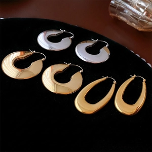 Polished stainless steel U-shaped and C-hoop earrings set in gold and silver finishes