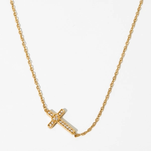 Elegant gold stainless steel cross necklace with zircon stones on a white background