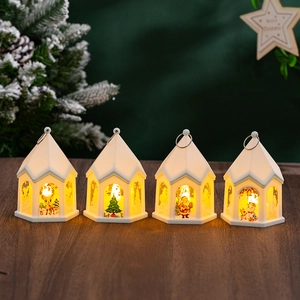 Set of four vintage glowing Christmas house lanterns with Santa and deer patterns