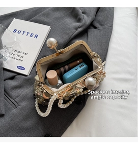 Detail of sequin evening bag showing interior space with power bank and cosmetics