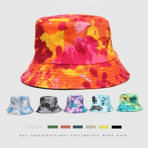 Detail showing multi-color tie-dye patterns and texture on street style bucket hats