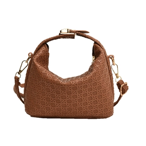 Brown woven texture pillow bag with gold hardware and adjustable strap for women