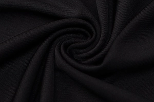 Macro close-up of high-elastic black knitted mesh fabric texture for bodycon dresses