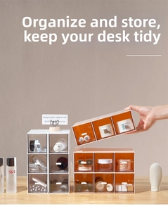 Close-up of modular desk organizer with transparent drawers and smooth U-shaped handles