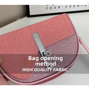 Detail of a color-block crossbody bag with striped fabric and pink glitter finish
