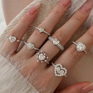 Elegant S925 sterling silver heart-shaped zircon rings set for women on soft fabric