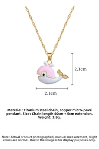 Macro shot of whale pendant with enamel finish and cubic zirconia detailing on chain