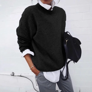 Women's autumn casual black knit sweater layered with white shirt collar and grey pants