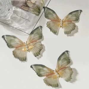 Elegant tulle butterfly hair clips with pearls in gradient pink and green shades