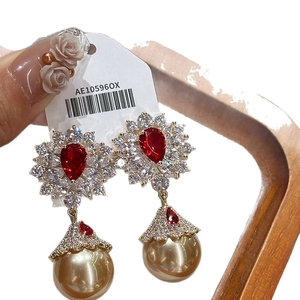 Elegant vintage drop earrings with pear-cut red stone and champagne gold pearls