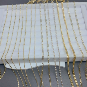 Detailed close-up of 18K gold plated chain styles including snake, Cuban and link chains