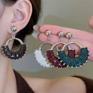 Retro round leather earrings with silver pins in black, white, burgundy, and green colors