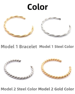 Detail view of four wave pattern twisted bangles in gold and silver finishes